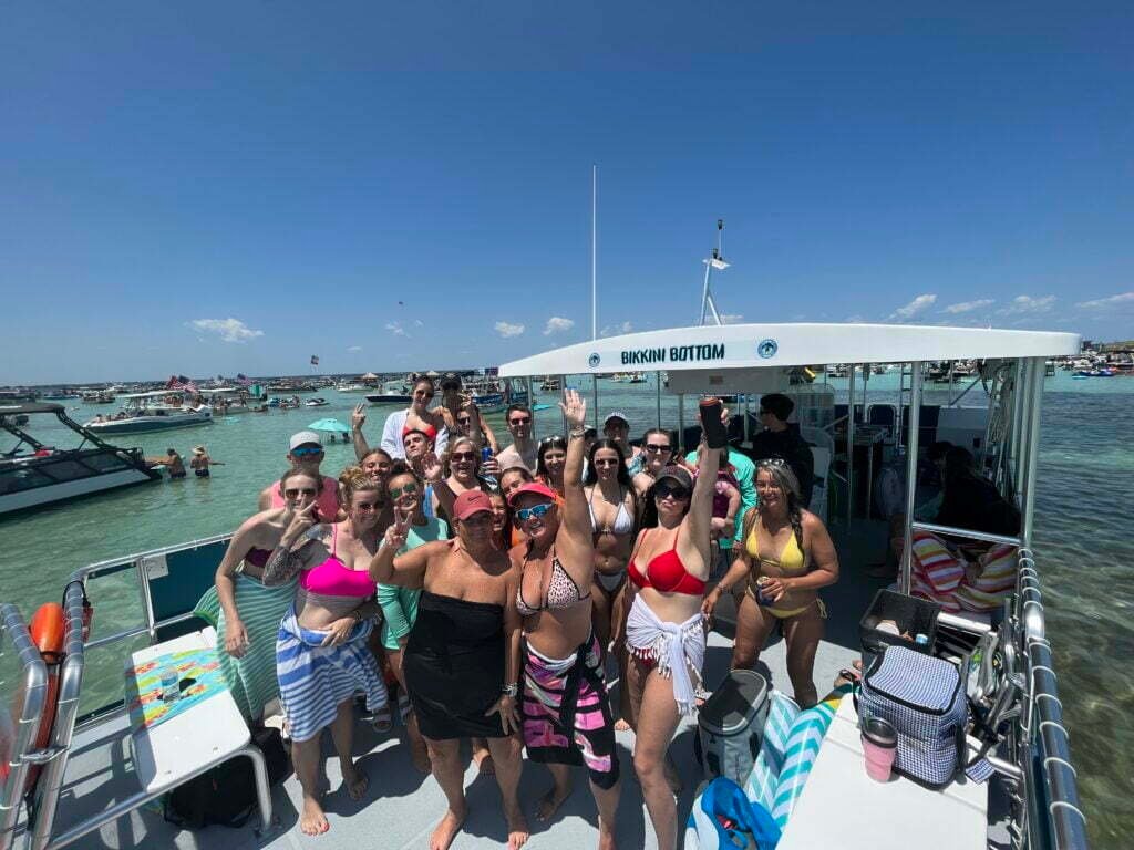 large group on crab island tours in fort walton beach on bikkini bottom from beach please charters