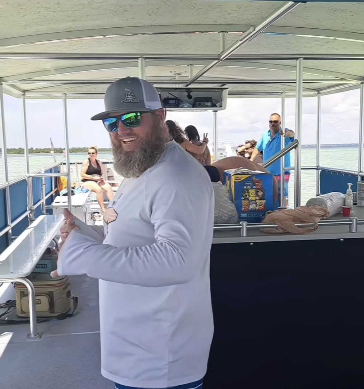 customer enjoying time in the shade on the boat during crab island tour from beach please charters fort walton beach fl