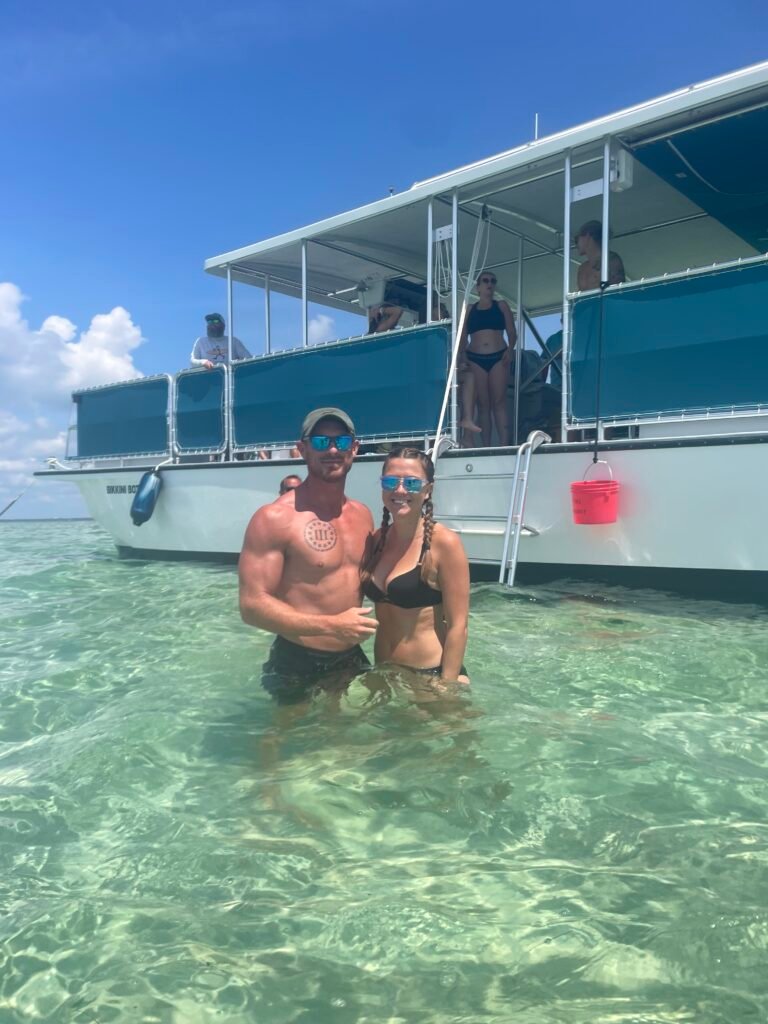 crab island charter fort walton beach fl people standing in water at crab island next to bikkini bottom boat from beach please charters