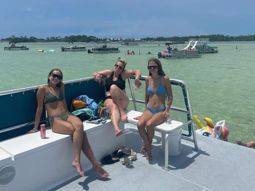 customers relaxing on bikkini bottom boat charter during crab island tour